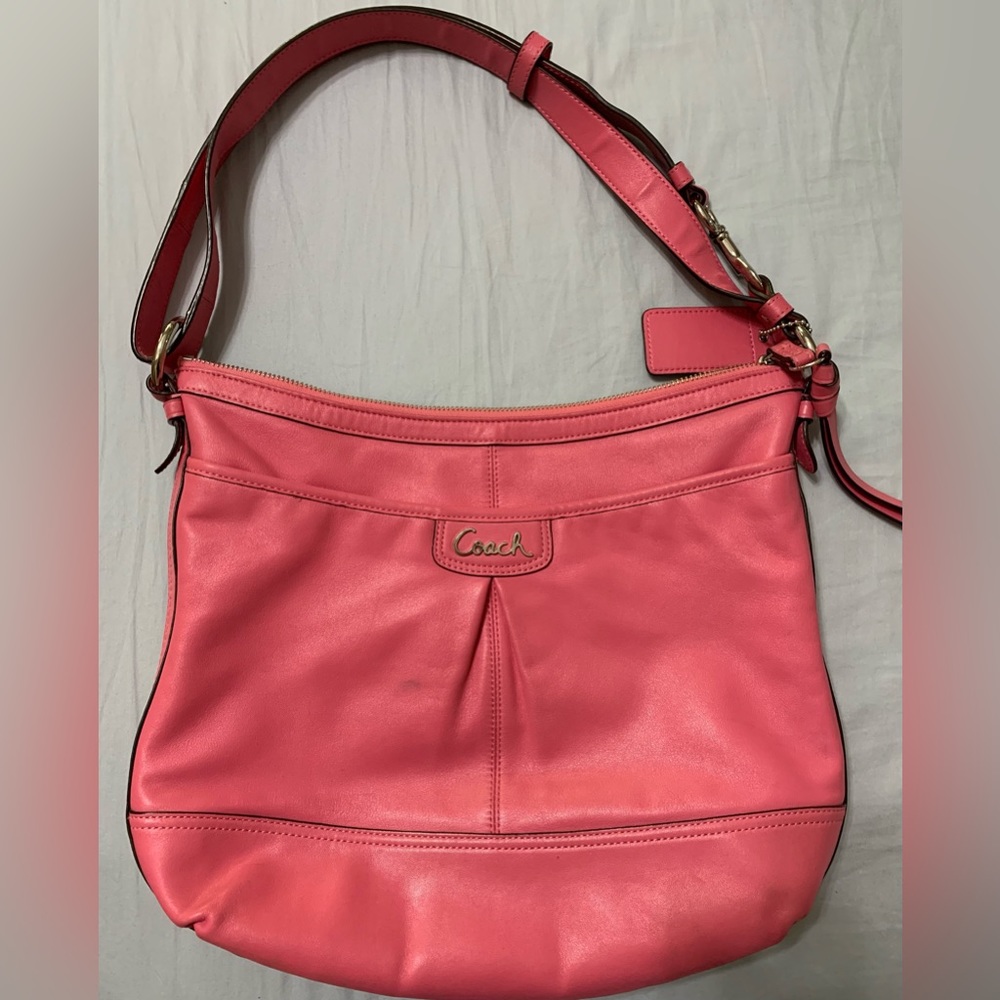 Coach pink purse; adjustable strap; taupe lining with inside zipper pocket